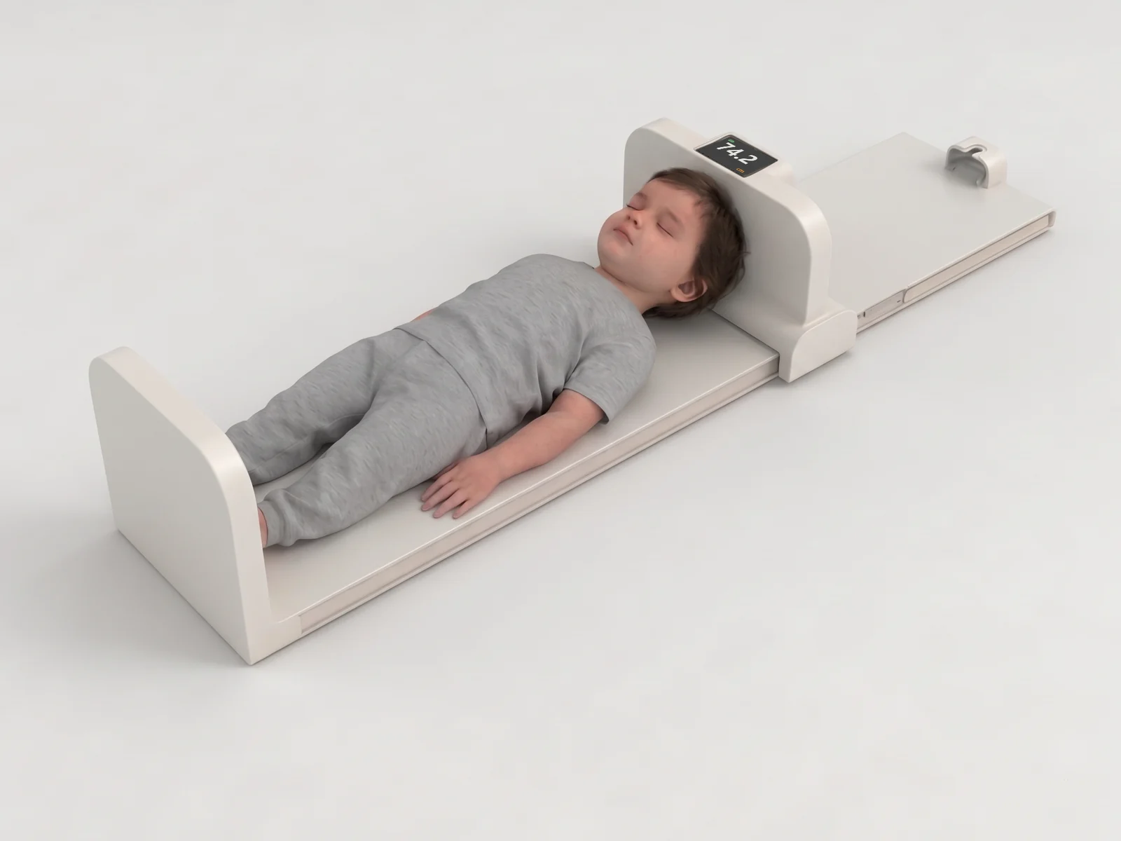A young child lying on the Zenko D100 in length mode, head against the headboard, the display reading 74.2 centimetres.